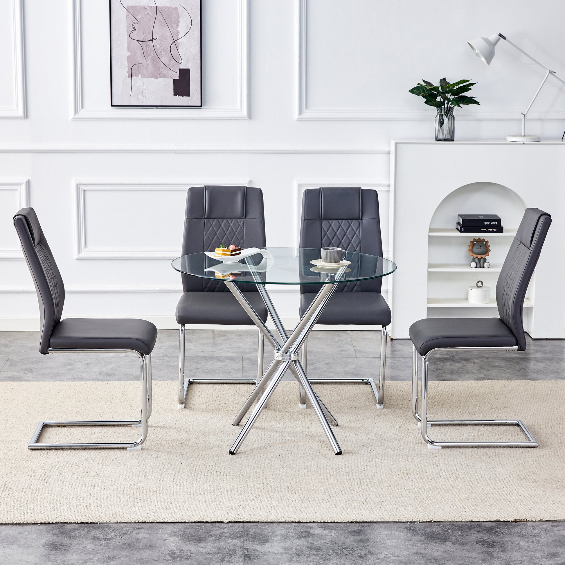 Table And Chair Set.36.6"Round Clear Glass Dining Table With A Unique Shape With Ring Shaped Gathered Silver Metal Legs.Paired With 4 Dark Gray High Quality Pu Dining Chairs With Silver Metal Legs.