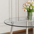 A Modern Minimalist Round Transparent Tempered Glass Table With Silver Metal Legs And 4 Modern Pu Leather High Backed Dining Chairs For A Luxurious Experience. Gray Seats 4 Glass Metal