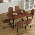 Table And Chair Set. A Minimalist Retro Rectangular Dining Table With A Specially Textured Top And Black Metal Legs, Paired With Soft Chairs And Black Metal Legs, Showcases A Beautiful Home Style. Brown Seats 6 Mdf Metal