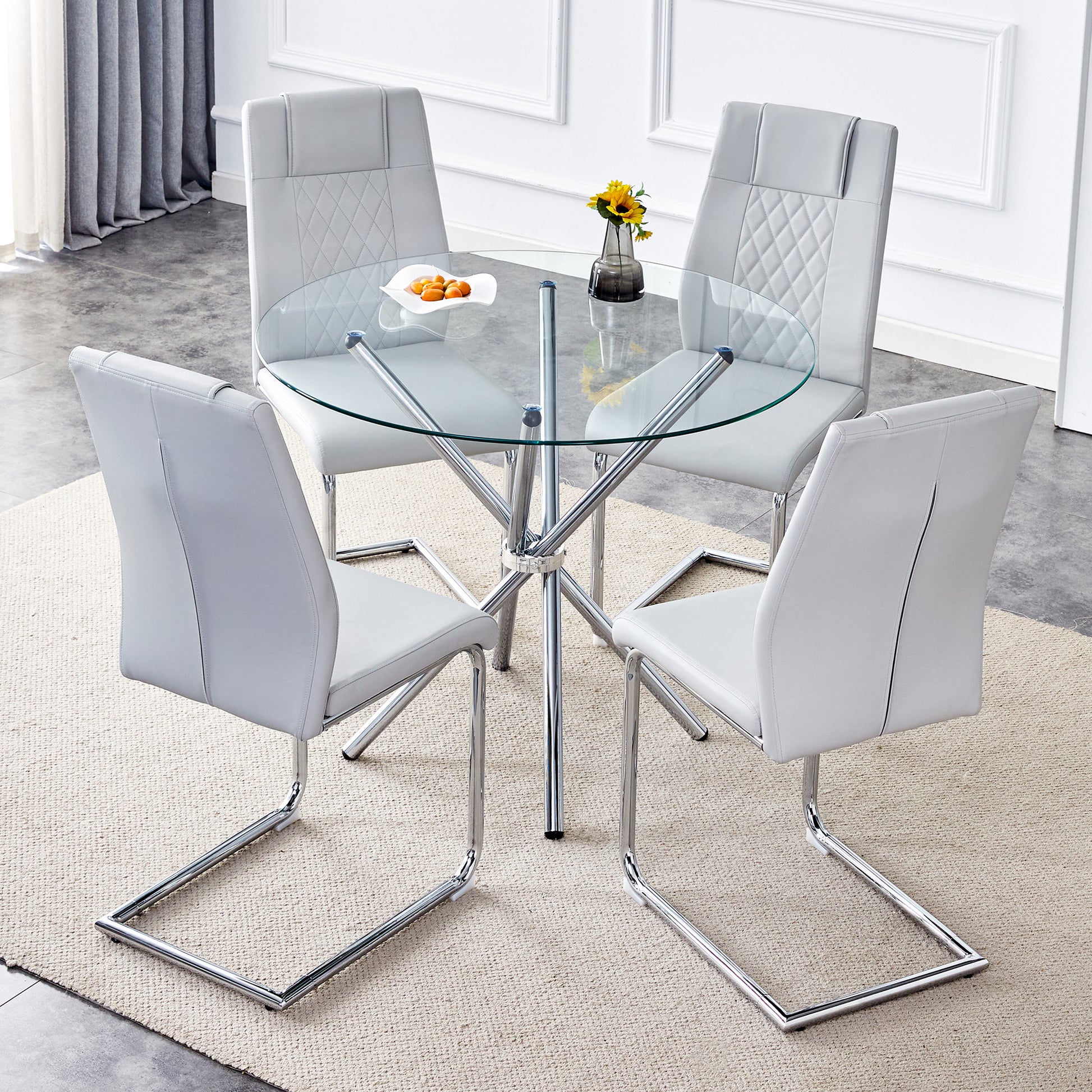 Table And Chair Set.36.6"Round Clear Glass Dining Table With A Unique Shape With Ring Shaped Gathered Silver Metal Legs.Paired With 4 Light Gray High Quality Pu Dining Chairs With Silver Metal Legs.