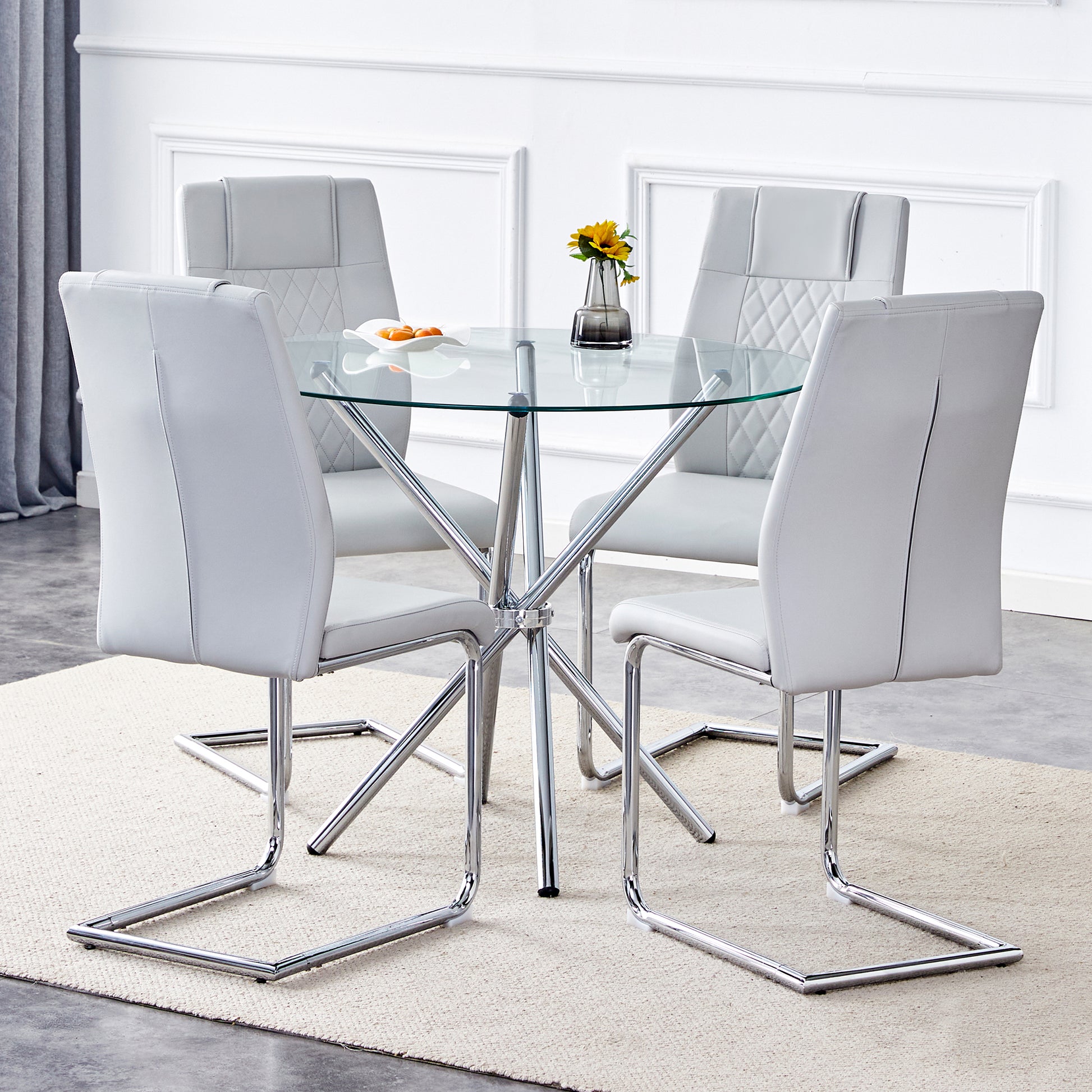Table And Chair Set.36.6"Round Clear Glass Dining Table With A Unique Shape With Ring Shaped Gathered Silver Metal Legs.Paired With 4 Light Gray High Quality Pu Dining Chairs With Silver Metal Legs.