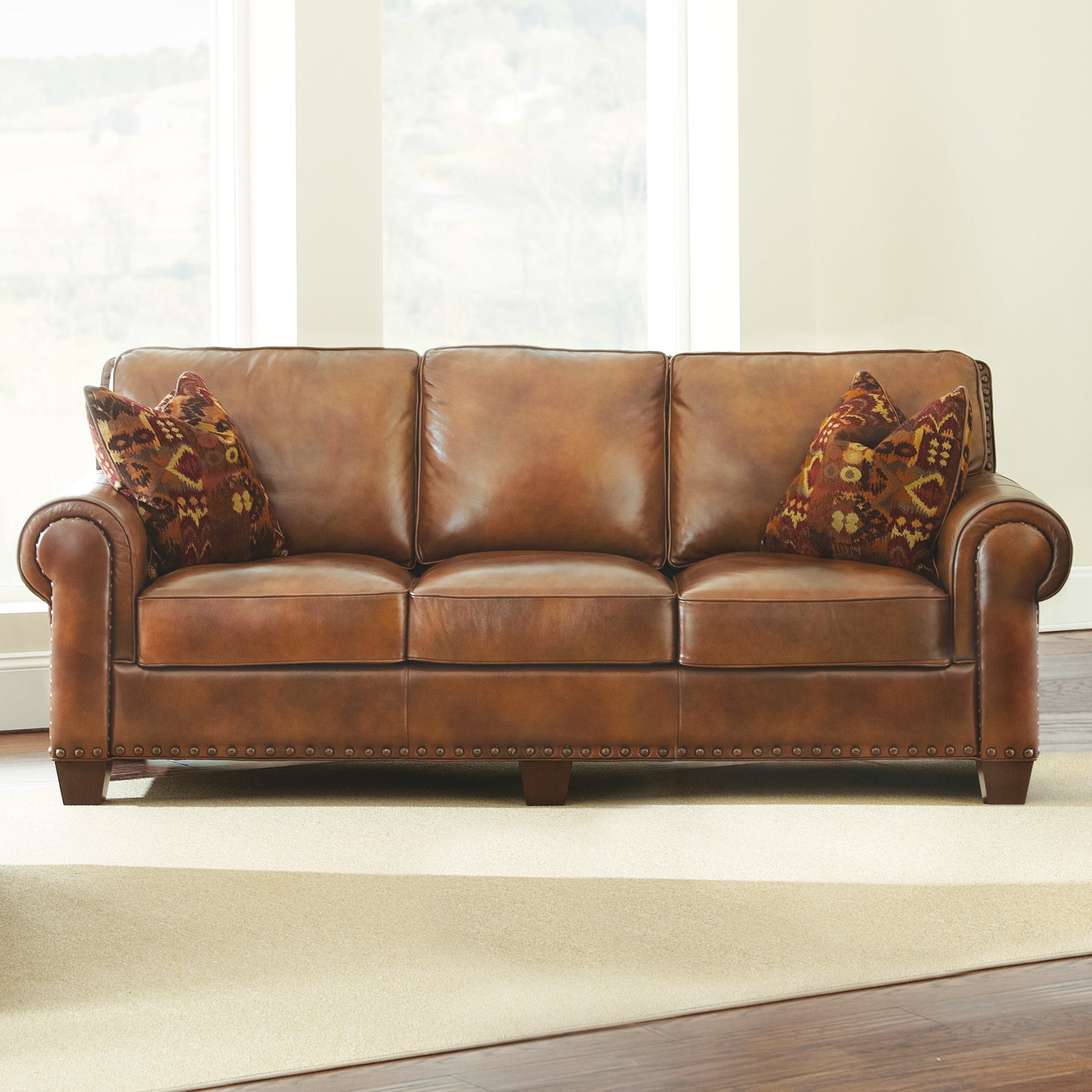 Rustic Styled Leather Sofa Premium Construction, Top Grain Leather Eight Way Hand Tied Springs, Nail Head Trim, Contrasting Pillows Tan Foam Leather 3 Seat