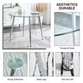 Table And Chair Set. 1 Table 4 Chairs Set A Circular Dining Table With A 40 Inch Diameter Glass Tabletop And Electroplated Metal Legs. 4 White Pu Chairs Dt 1164 001 Transparent Seats 4 Glass