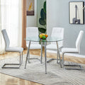 Table And Chair Set. 1 Table 4 Chairs Set A Circular Dining Table With A 40 Inch Diameter Glass Tabletop And Electroplated Metal Legs. 4 White Pu Chairs Dt 1164 001 Transparent Seats 4 Glass