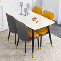Table And Chair Set. White Imitation Marble Patterned Burnt Stone Tabletop With Black Metal Legs. Orange Deep Gray Dual Tone Pu Leather Backrest And Black Metal Leg Chair. 1 Table And 4 Chairs 001 007 White Sintered Stone