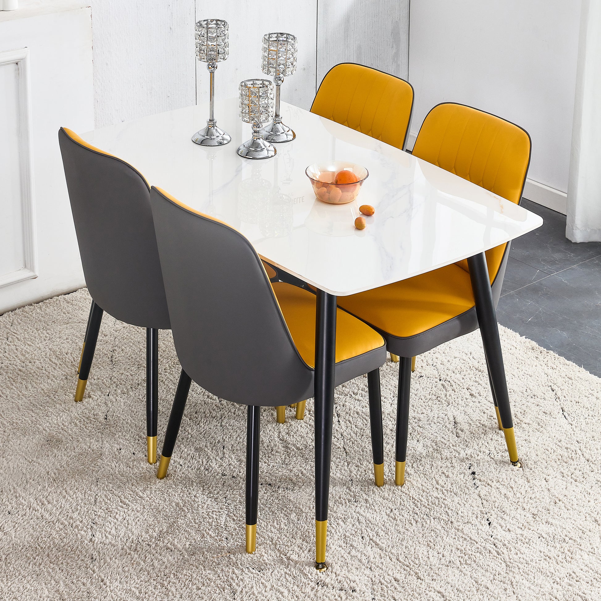 Table And Chair Set. White Imitation Marble Patterned Burnt Stone Tabletop With Black Metal Legs. Orange Deep Gray Dual Tone Pu Leather Backrest And Black Metal Leg Chair. 1 Table And 4 Chairs 001 007 White Sintered Stone