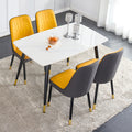 Table And Chair Set. White Imitation Marble Patterned Burnt Stone Tabletop With Black Metal Legs. Orange Deep Gray Dual Tone Pu Leather Backrest And Black Metal Leg Chair. 1 Table And 4 Chairs 001 007 White Sintered Stone