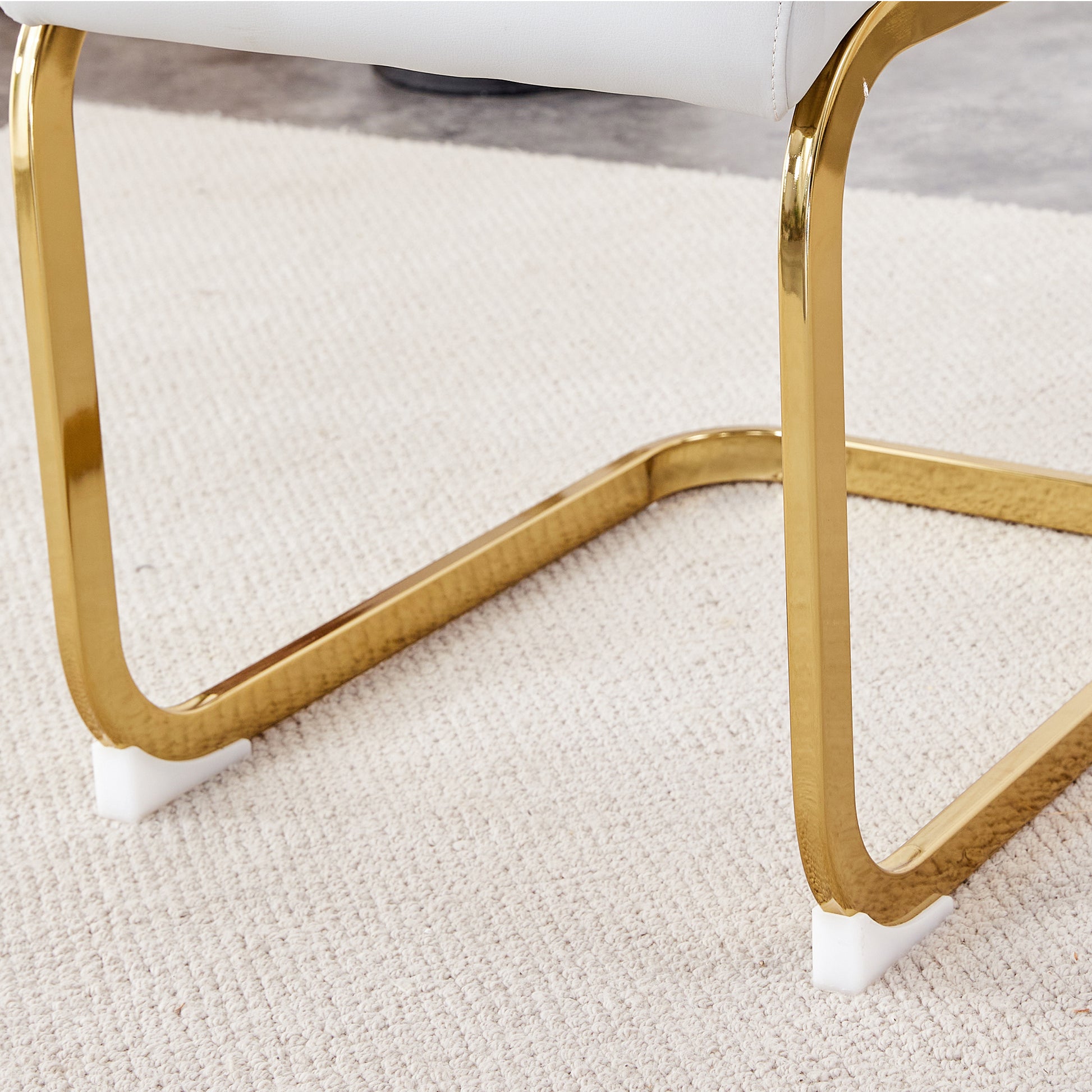 Table And Chair Set. 1 Table And 4 White Pu Backrest Cushions With Gold Metal Leg Chairs . A Rectangular White Imitation Marble Desktop With Mdf Legs And Gold Metal Decorative Strips. Hh1162 White Mdf Glass