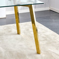 Modern Minimalist Style Rectangular Glass Dining Table With Tempered Glass Tabletop And Golden Metal Legs, Suitable For Kitchen, Dining Room, And Living Room, 63 Inches * 35.4 Inches * 30 Inches Golden Metal