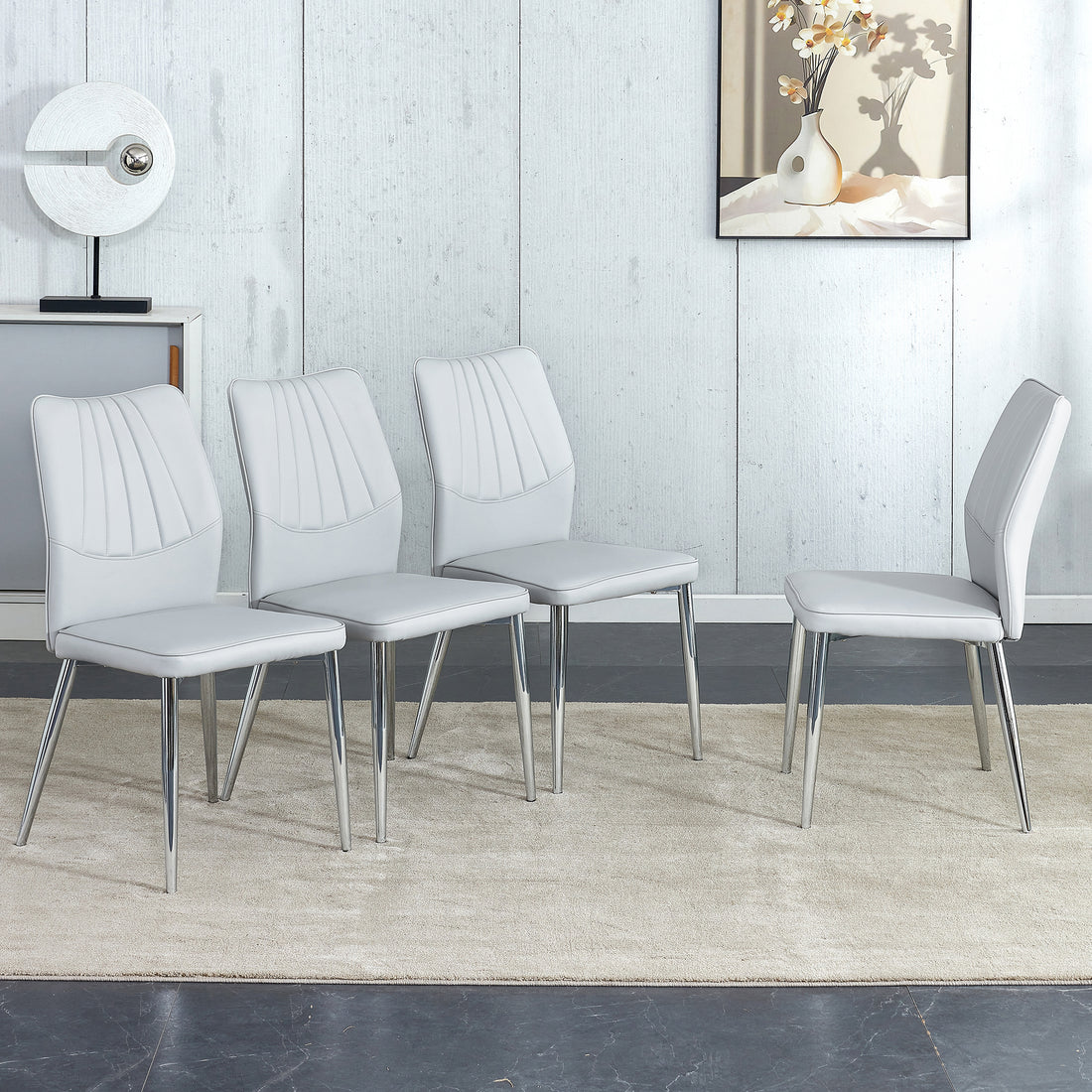 Four Light Gray Dining Chairs. A Medieval Modern Chair Made Of Pu Material With Soft Cushions And Silver Metal Legs. Suitable For Restaurants And Living Rooms Light Gray Pu