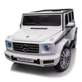 Licensed Mercedes Benz G500,24V Kids Ride On Toy 2.4G W Parents Remote Control,Electric Car For Kids,Three Speed Adjustable,Power Display, Usb,Mp3 ,Bluetooth,Led Light,Three Point Safety Belt White Plastic