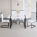 Table And Chair Set.A Modern Minimalist White Marble Veined Mdf Dining Table With Black Metal Frame.Paried With 4 Chairs With White Pu Cushions And C Tube Black Metal Legs. White Seats 4 Mdf Metal