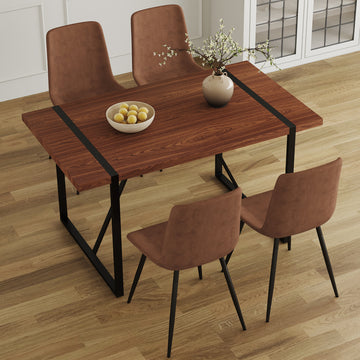 Table And Chair Set. A Minimalist Retro Rectangular Dining Table With A Specially Textured Top And Black Metal Legs, Paired With Soft Chairs And Black Metal Legs, Showcases A Beautiful Home Style.