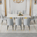 Table And Chair Set.The Table Has A Glass Top With Imitation Marble Pattern Stickers And Stainless Steel Golden Legs. Paried With Chairs With Pu Artificial Leather Backrest Cushions And Black Legs. White Gold Seats 8 Glass Metal