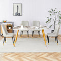 Table And Chair Set.Modern Minimalist Dining Table. White Imitation Marble Pattern Sintered Stone Desktop With Golden Metal Legs.Paried With 4 Comfortable Chairs With Pu Seats And Black Metal Legs.