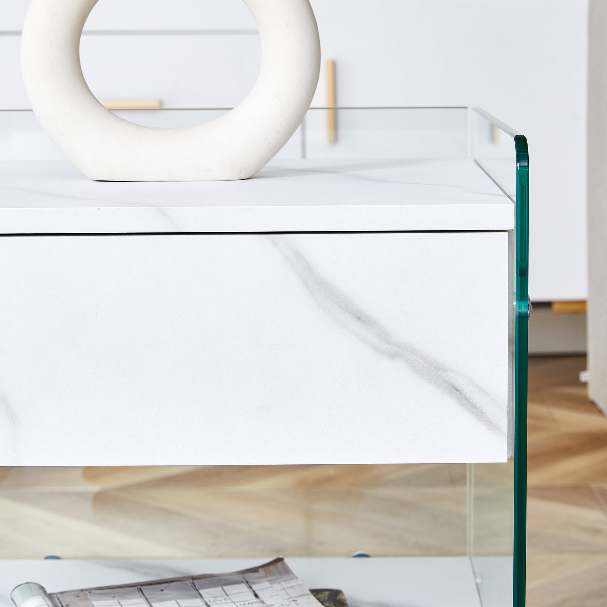 Bedside Table With Drawers. The Board Surface Is Mdf Sticker, And Both Sides Are Transparent Tempered Glass. The Design Is Simple And Elegant, With Excellent Storage Functions. White 1 Drawer Mdf Glass