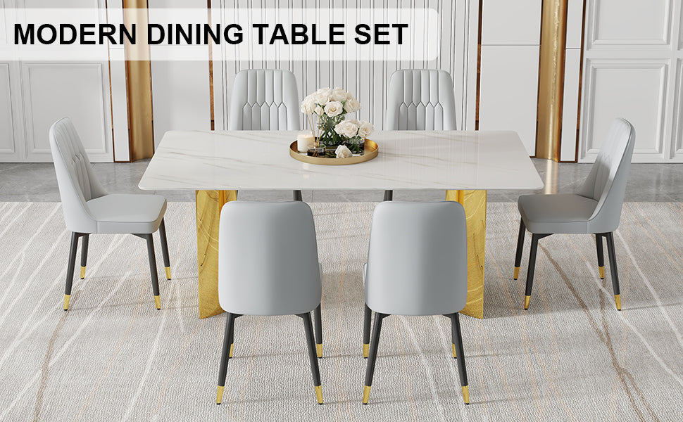 Table And Chair Set.The Table Has A Glass Top With Imitation Marble Pattern Stickers And Stainless Steel Golden Legs. Paried With Chairs With Pu Artificial Leather Backrest Cushions And Black Legs.