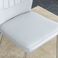 Table And Chair Set.Contemporary, Minimalist Rectangular Dining Table Featuring A Clear Tempered Glass Top And Sleek Silver Legs. Paried With Chairs Made Of Pu Material Cushion And Silver Metal Legs. Light Gray Seats 6 Glass Metal