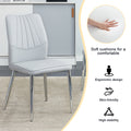 Table And Chair Set.Contemporary, Minimalist Rectangular Dining Table Featuring A Clear Tempered Glass Top And Sleek Silver Legs. Paried With Chairs Made Of Pu Material Cushion And Silver Metal Legs. Light Gray Seats 6 Glass Metal