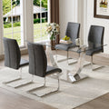 Table And Chair Set.Modern Dining Table,Tempered Glass Tabletop And Silver Colored Leg.Paired With 4 Soft And Comfortable Dark Gray Pu Chair, Perfect For Dinner, Meetings, Home And Office Decor.