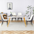 Table And Chair Set.Modern Minimalist Dining Table. White Imitation Marble Pattern Sintered Stone Desktop With Golden Metal Legs.Paried With 4 Comfortable Chairs With Pu Seats And Black Metal Legs.