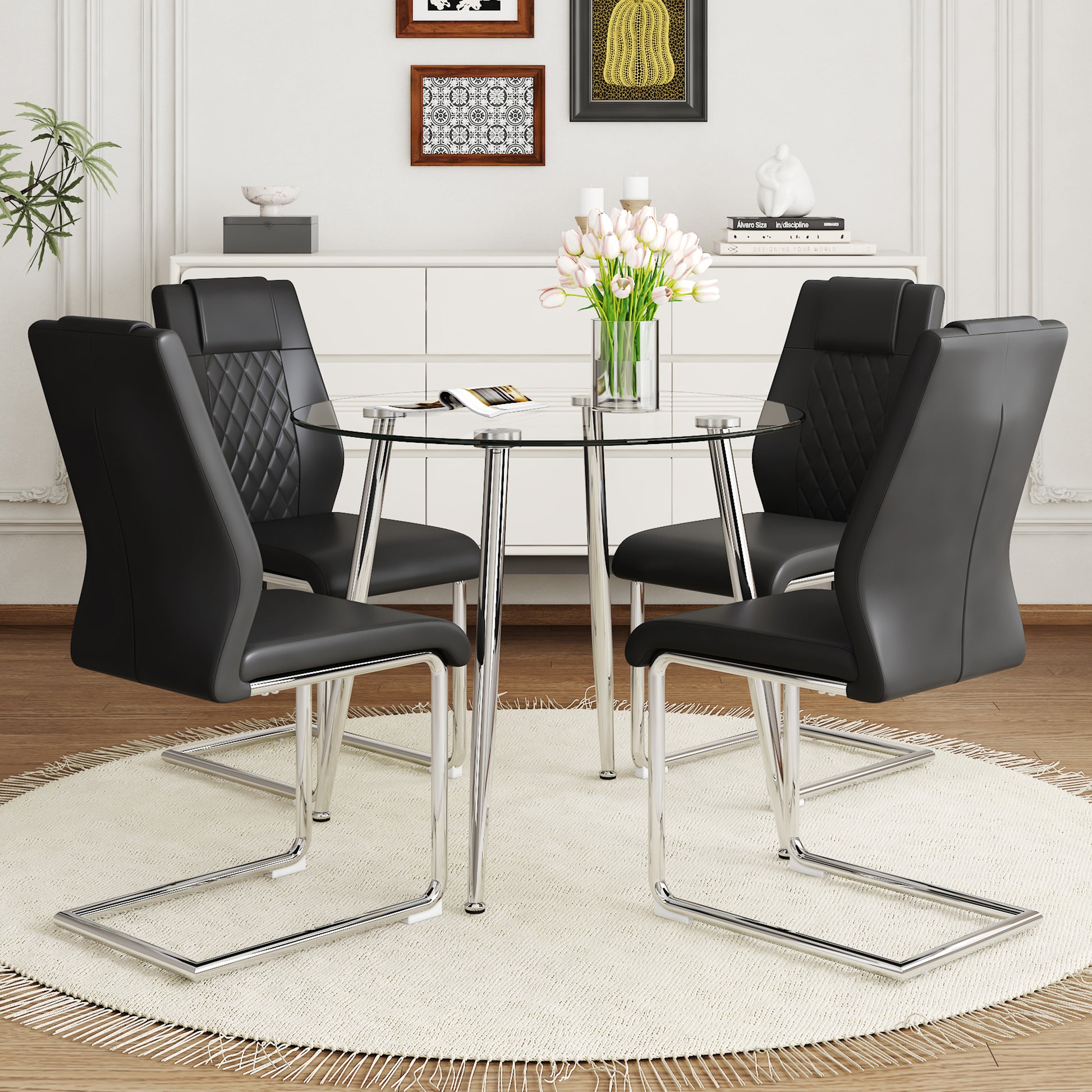 A Modern Minimalist Round Transparent Tempered Glass Table With Silver Metal Legs And 4 Modern Pu Leather High Backed Dining Chairs For A Luxurious Experience. Black Seats 4 Glass Metal