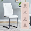 Table And Chair Set. Large Modern Rectangular Table With Black Textured Top And Black Metal Legs. Soft And Comfortable Pu Seats, Faux Leather Upholstered Seats And Sturdy Metal Legs. White Black Seats 4 Sintered Stone