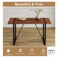 Table And Chair Set. A Minimalist Retro Rectangular Dining Table With A Specially Textured Top And Black Metal Legs, Paired With Soft Chairs And Black Metal Legs, Showcases A Beautiful Home Style. Brown Seats 6 Mdf Metal