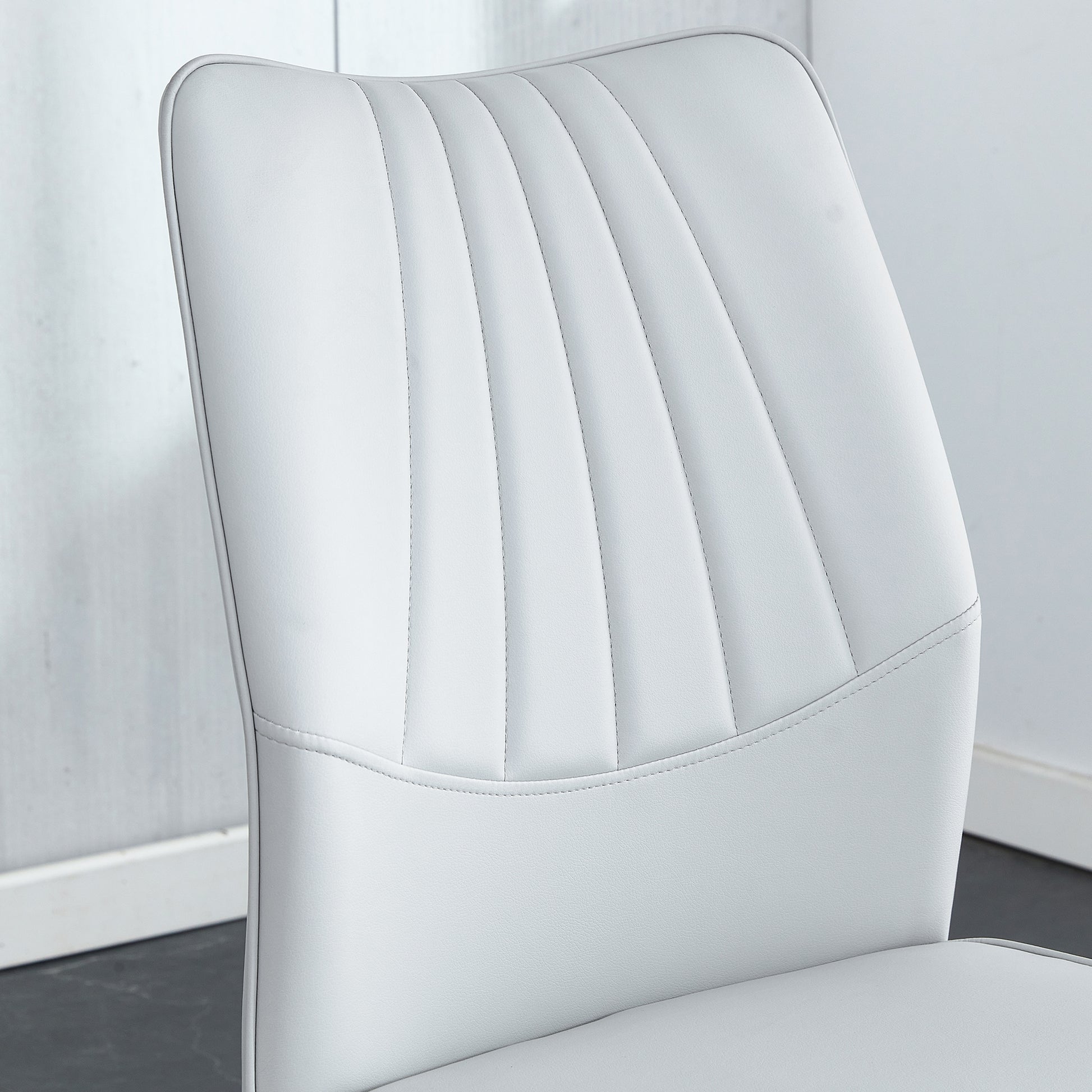 Table And Chair Set.Contemporary, Minimalist Rectangular Dining Table Featuring A Clear Tempered Glass Top And Sleek Silver Legs. Paried With Chairs Made Of Pu Material Cushion And Silver Metal Legs. Light Gray Seats 6 Glass Metal