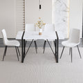 Table And Chair Set.A Modern Minimalist White Marble Veined Mdf Dining Table With Metal Frame.Paried With 4 Chairs With Pu Cushions And Black Metal Legs. White Seats 4 Mdf Metal