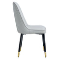 Table And Chair Set.The Table Has A Glass Top With Imitation Marble Pattern Stickers And Stainless Steel Golden Legs. Paried With Chairs With Pu Artificial Leather Backrest Cushions And Black Legs. Black Gold Seats 8 Glass Metal