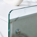 Bedside Table With Drawers. The Board Surface Is Mdf Sticker, And Both Sides Are Transparent Tempered Glass. The Design Is Simple And Elegant, With Excellent Storage Functions. White 1 Drawer Mdf Glass