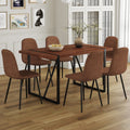 Table And Chair Set. A Minimalist Retro Rectangular Dining Table With A Specially Textured Top And Black Metal Legs, Paired With Soft Chairs And Black Metal Legs, Showcases A Beautiful Home Style. Brown Seats 6 Mdf Metal