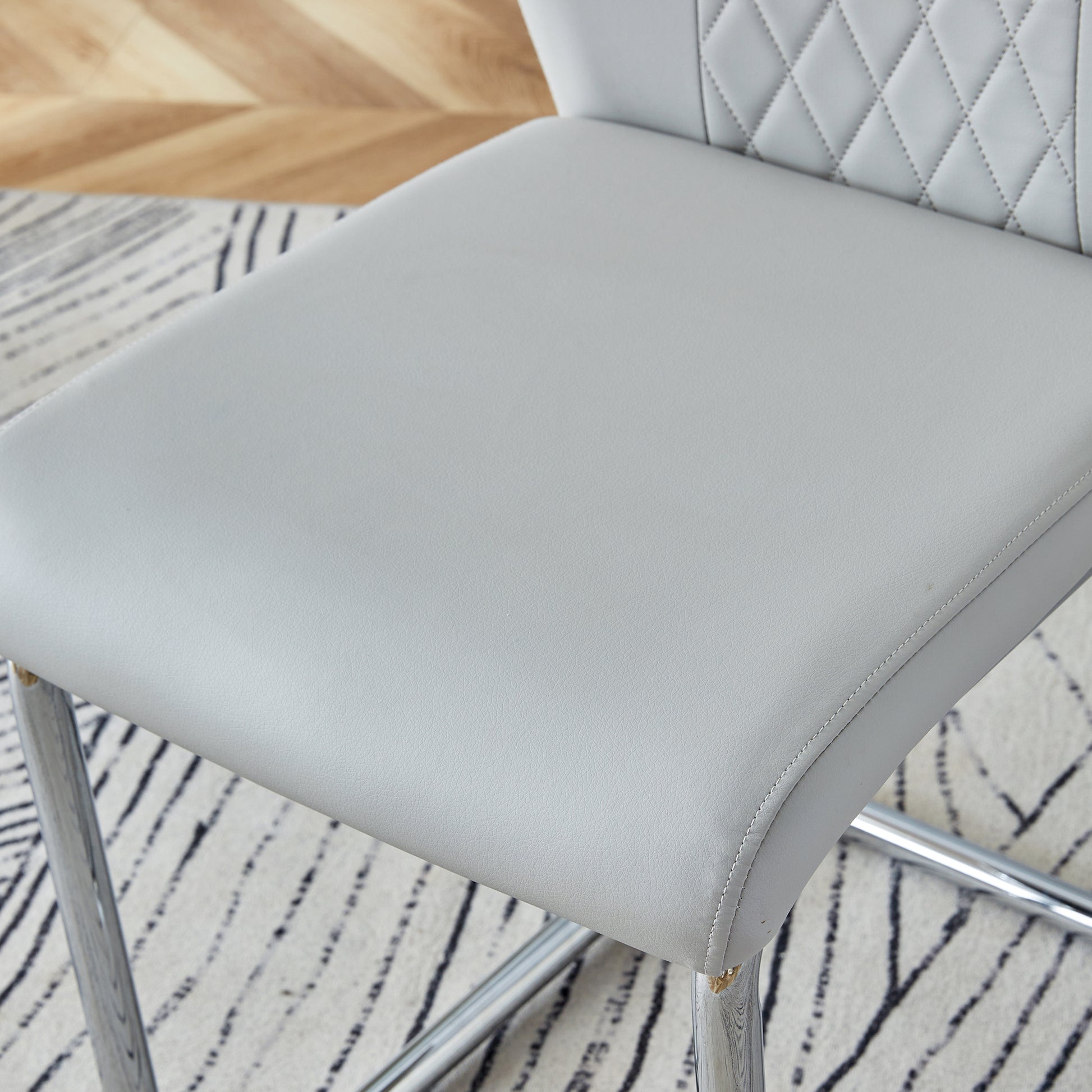 Table And Chair Set.36.6"Round Clear Glass Dining Table With A Unique Shape With Ring Shaped Gathered Silver Metal Legs.Paired With 4 Light Gray High Quality Pu Dining Chairs With Silver Metal Legs.