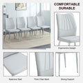 Table And Chair Set.Contemporary, Minimalist Rectangular Dining Table Featuring A Clear Tempered Glass Top And Sleek Silver Legs. Paried With Chairs Made Of Pu Material Cushion And Silver Metal Legs. Light Gray Seats 6 Glass Metal