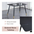 Table And Chair Set. Large Modern Rectangular Table With Black Textured Top And Black Metal Legs. Soft And Comfortable Pu Seats, Faux Leather Upholstered Seats And Sturdy Metal Legs. Grey Black Seats 4 Sintered Stone
