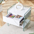 Bedside Table With Drawers. The Board Surface Is Mdf Sticker, And Both Sides Are Transparent Tempered Glass. The Design Is Simple And Elegant, With Excellent Storage Functions. White 1 Drawer Mdf Glass