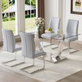 Table And Chair Set.Modern Dining Table,Tempered Glass Tabletop And Silver Colored Leg.Paired With 4 Soft And Comfortable Light Gray Pu Chair, Perfect For Dinner, Meetings, Home And Office Decor.