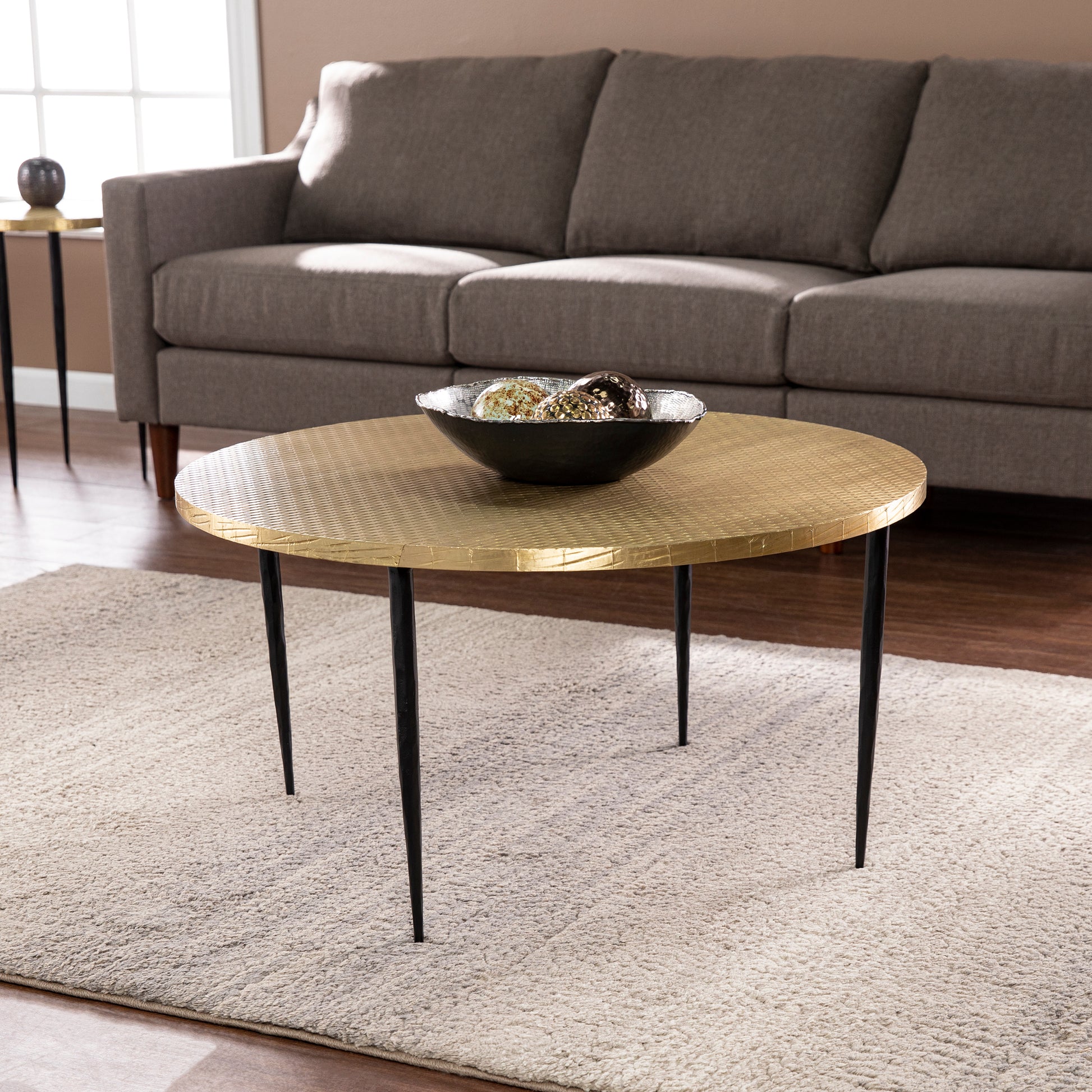 Judmont Round Cocktail Table W Embossed Top Black Iron